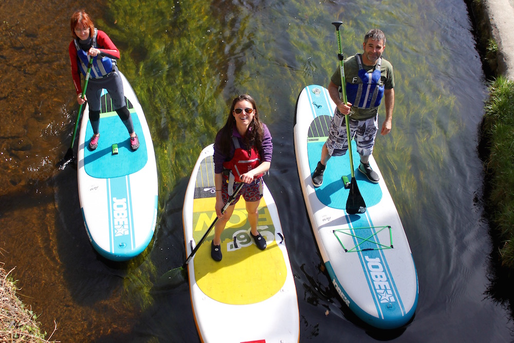 Stand up paddle boarding group